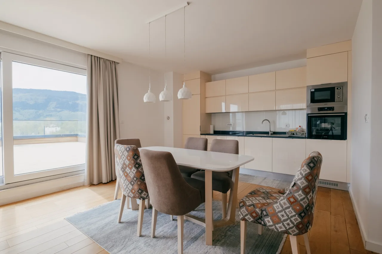 Kitchen — Three-bedroom apartment. Cream kitchen and terrace